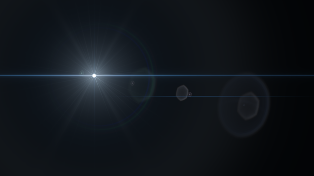 A cool headlight-inspired flare against deep shadows.